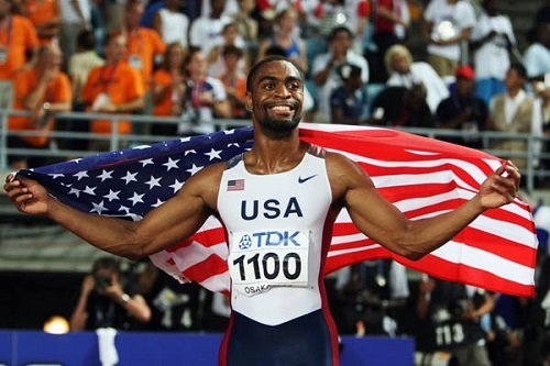 OSAKA, JAPAN - AUGUST 26:  Tyson Gay of the United States of America celebrates winning the Men's 100m final on day two of the 11th IAAF World Athletics Championships on August 26, 2007 at the Nagai Stadium in Osaka, Japan. Tyson Gay was the Gold Medal winner.  (Photo by Andy Lyons/Getty Images)